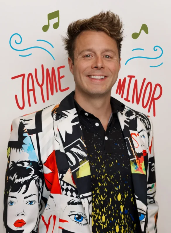 Jayme Minor in a comic book print suit with musical notes and wavy lines