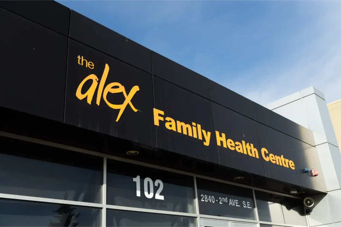 The Alex Family Health Centre building exterior with yellow signage.